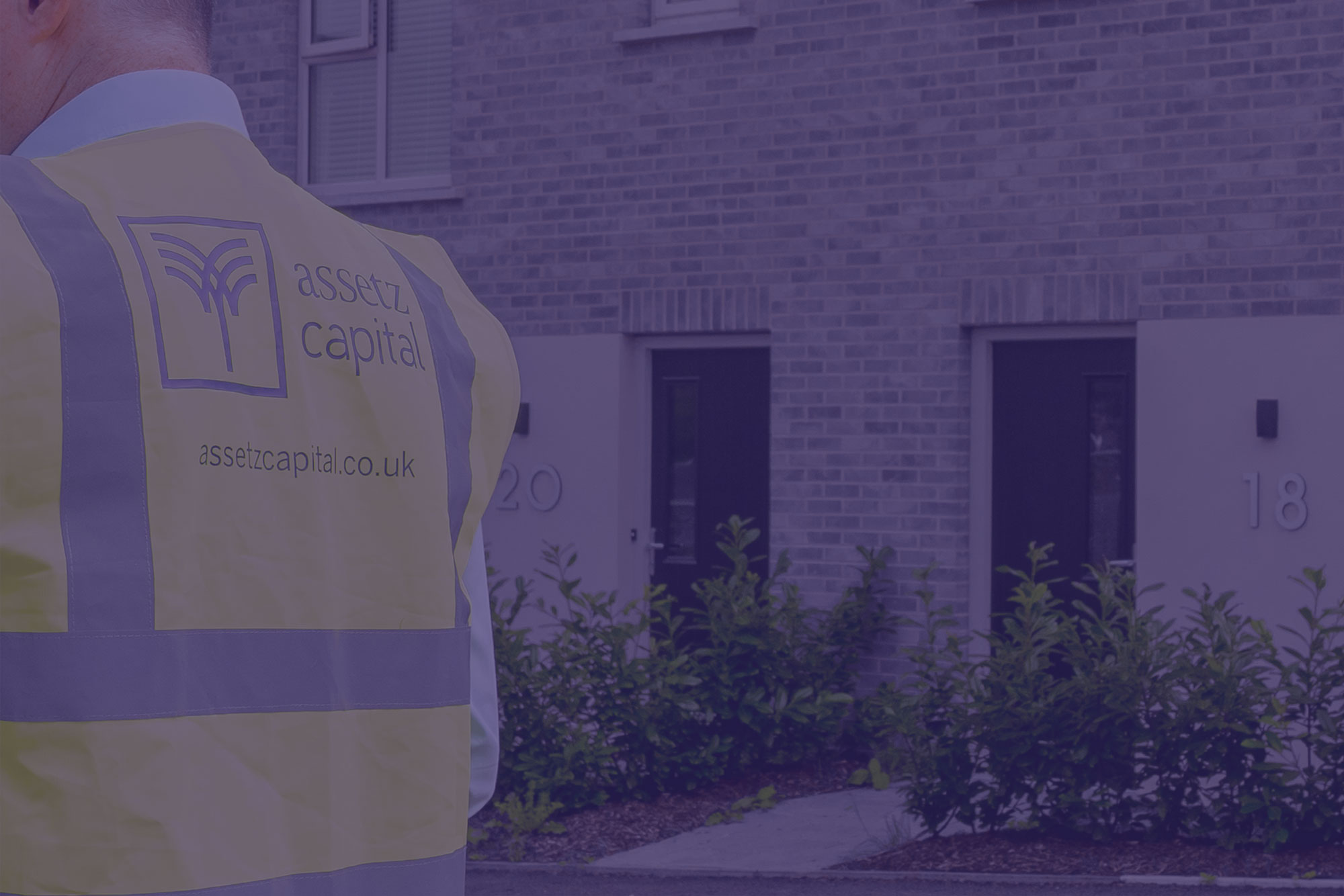 Background image of a Relationship Director wearing our branded tabard